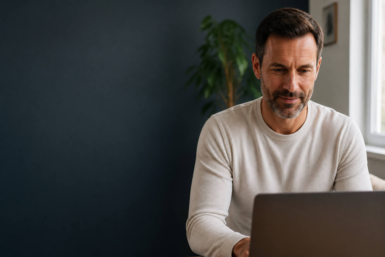 Man speaking with a clinician from home by video call